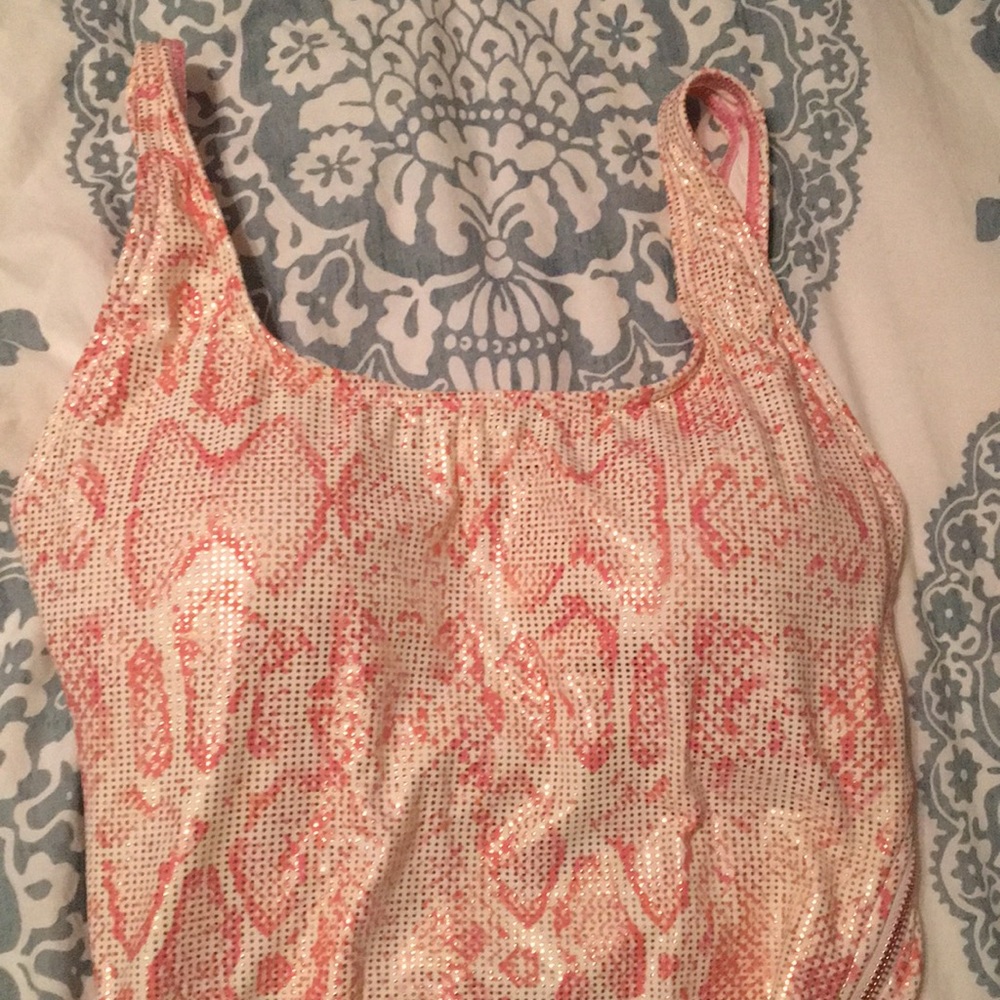 One piece swimsuit, new with tags. Size 8.